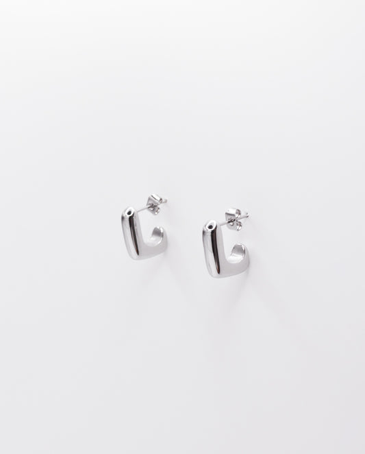 Maude - minimalistic design earrings , silver color