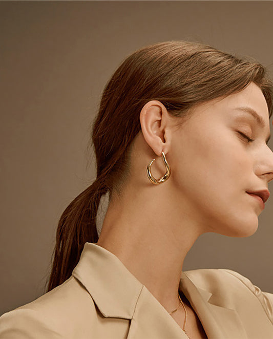 Iris - elegant 18k gold plated hoop earrings with a modern twist , gold color