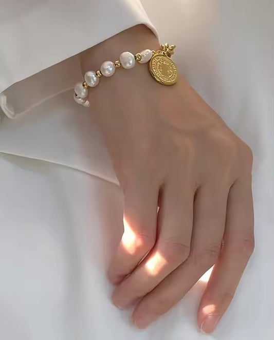 Aveline - natural pearls bracelet with 18k gold plated finishing with coins pedant