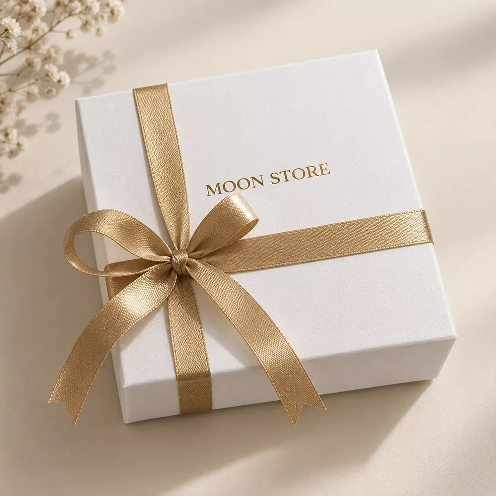 Moon Store gift box with a gold ribbon